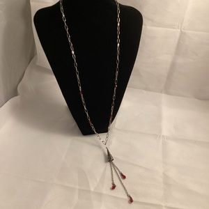 Red beads on silver tone chain with metallic tassel necklace